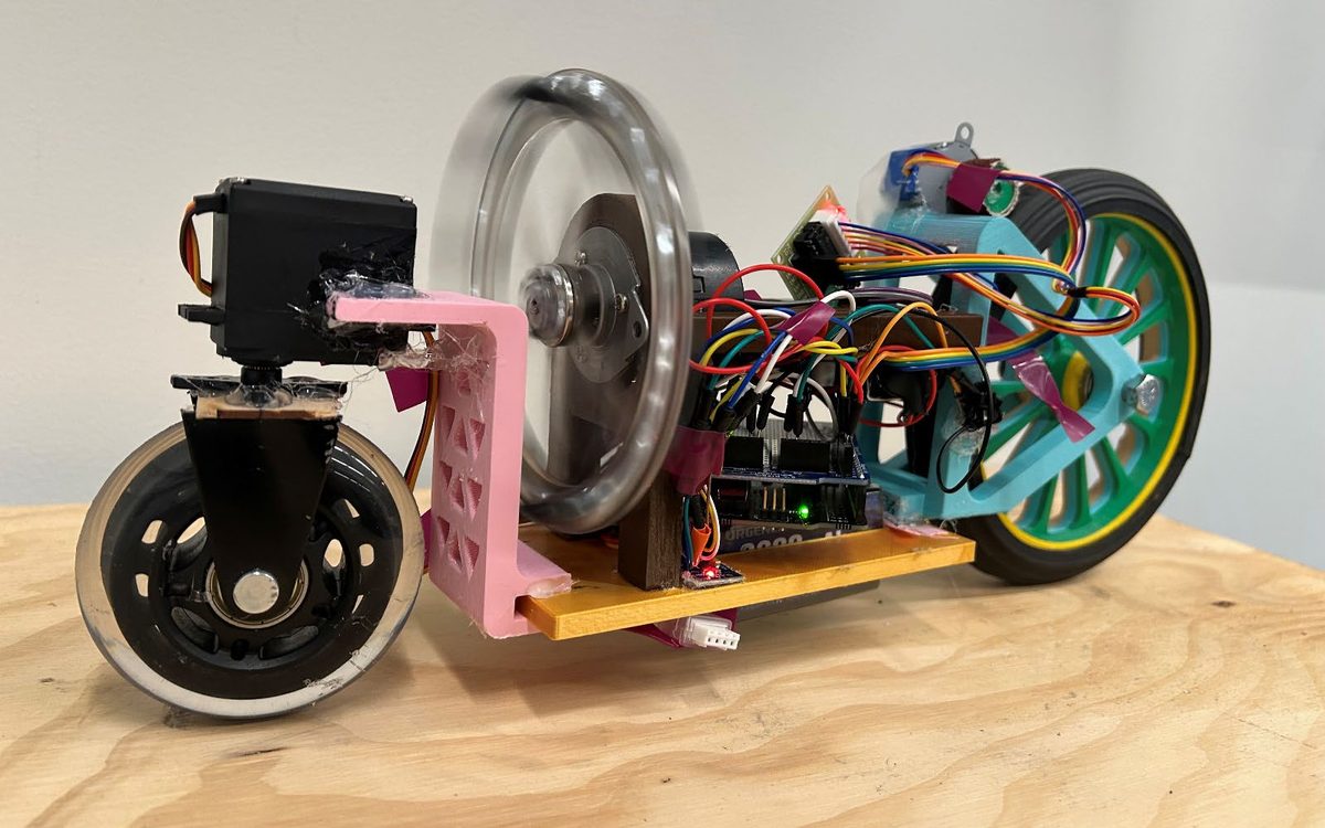 Reaction-wheel self-balancing bicycle